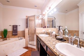 Separate stand-up shows with rainwater showerheads in select apartments